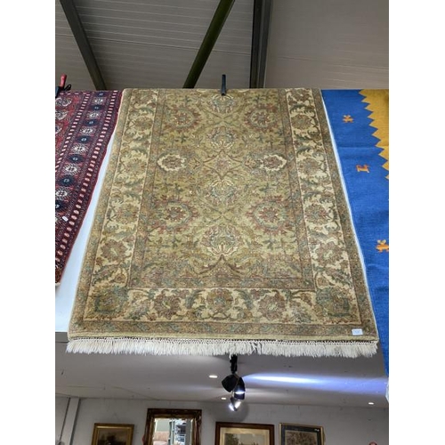 82 - Green ground Persian rug 190 x 125cm