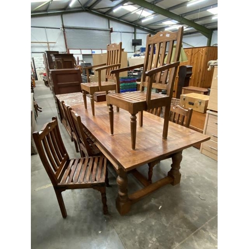 Good quality oak dining table 77H 210W 100D and 8 chairs including 2 carvers