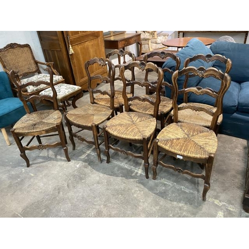 86 - 7 French oak rush seated dining chairs (1 as found)