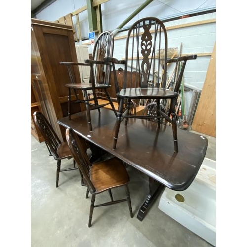 40 - 20th century oak dining table 75H 166W 78D and 6 Fleur de Lys dining chairs including 2 carvers