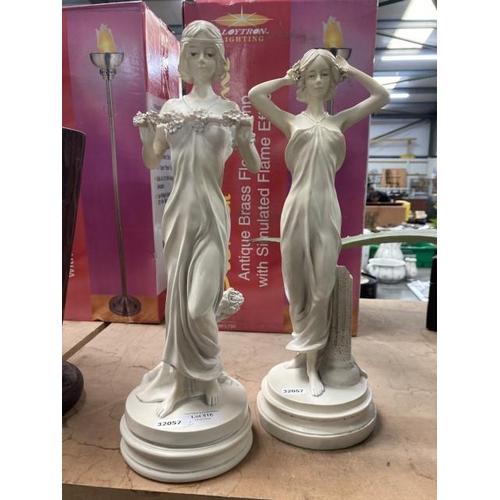 516 - Pair of classical figurines on circular plinths, 39cm tall