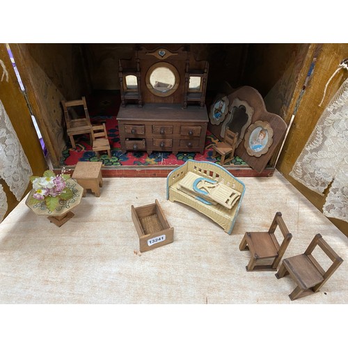 556 - Vintage dolls house with furniture and accessories and a wooden dolls bed (no mattress/bedding)