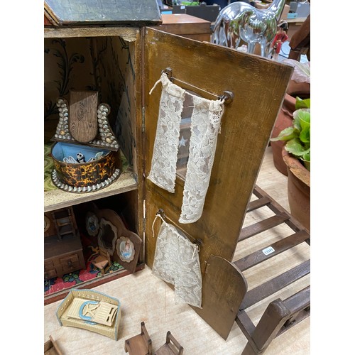 556 - Vintage dolls house with furniture and accessories and a wooden dolls bed (no mattress/bedding)