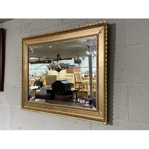 28 - Gilt framed bevel edged mirror 66 x 86cm