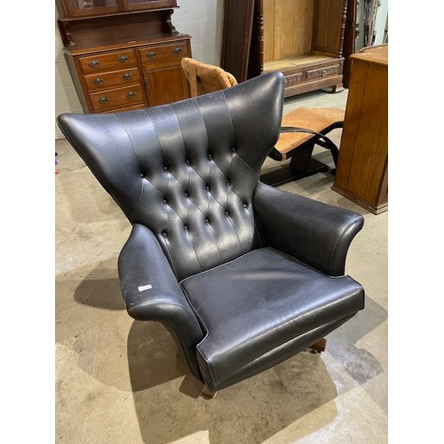 29 - Original 1960's mid century G Plan 6250 Blodfeld swivel armchair in original black vinyl 100H 95W 10... 