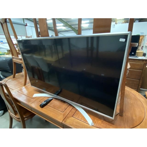 60 - LG 49UJ701V TV with power lead and remote