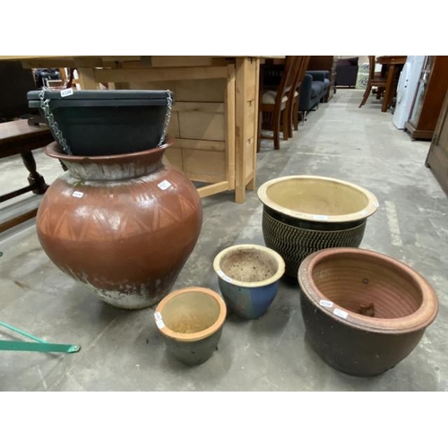 84 - 7 assorted planters including 2 hanging baskets, urn shaped planter 51H 34cm diameter, and 4 glazed ... 