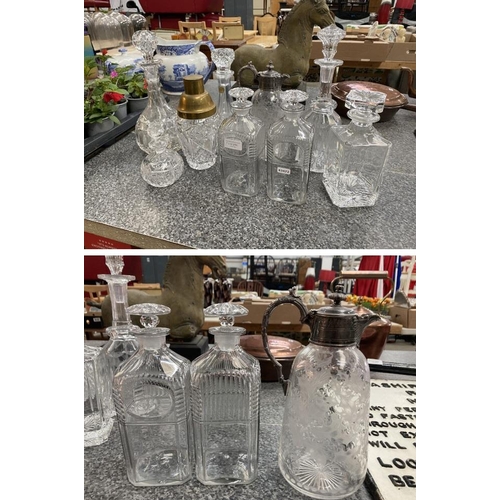 284 - Collection of glass decanters, cocktail shaker inc. thistle etched glass ewer