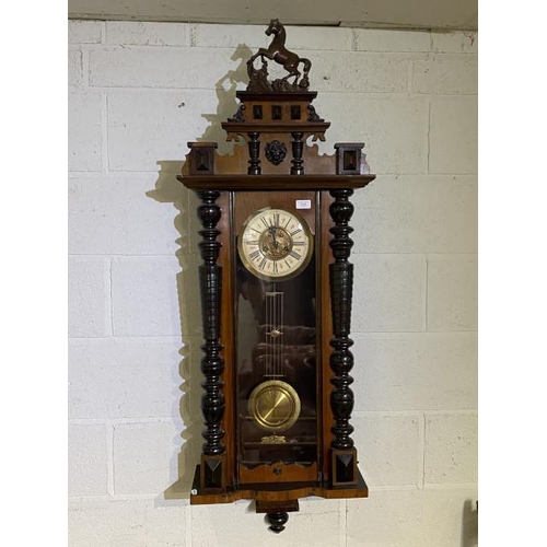 93 - Late 19th century mahogany Vienna wall clock with pendulum and key (in working order) 140H 46W 19D