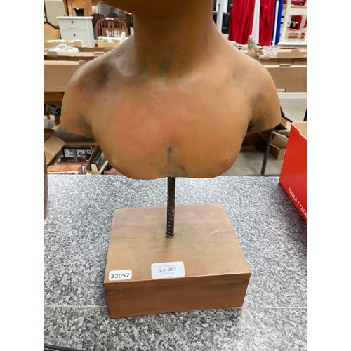 282 - Bust of child on stand 50cm H