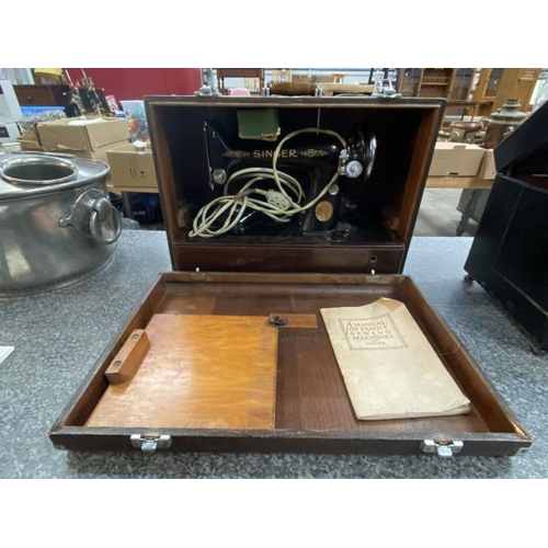 287 - Cased Singer EE169942 electric sewing machine with foot pedal and manual