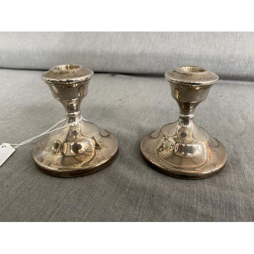 312 - Pair of S & M, Birmingham 1975 silver weighted candlesticks (252.7g 8H)