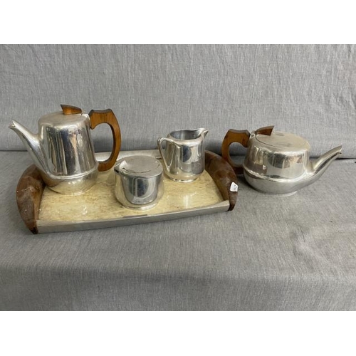 355 - Piquot Ware tray, teapot, water jug, cream and sugar bowl