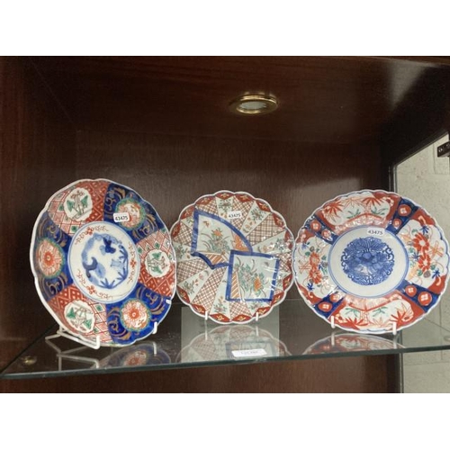 385 - 3 19th/20th century Japanese Imari plates (22cm diameter) one has been repaired