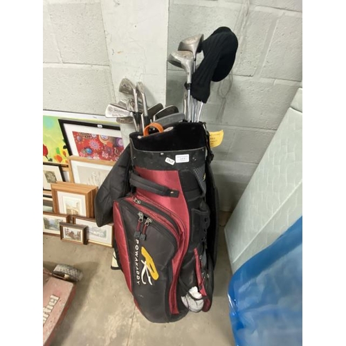 4 - Powerkaddy golf bag and assorted clubs including Wilson