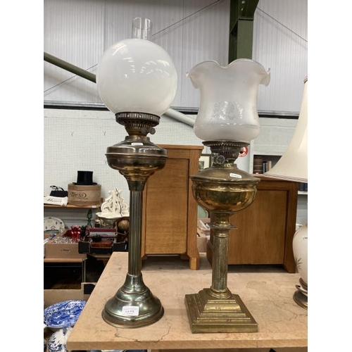 416 - 2 brass oil lamps with globes and one funnel