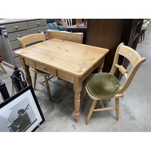 53 - Good quality pine table 77H 99W 75D and 2 chairs