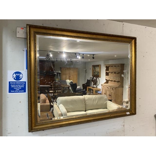 83 - Gilt framed bevel edged mirror 90 x 116cm