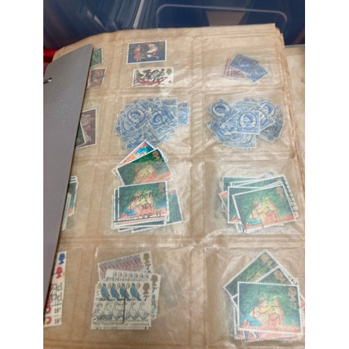 447 - Collection of stamps and ephemera consisting of albums, tins full of stamps and reference books, ass... 