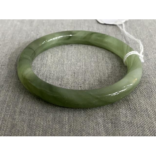 309 - Polished jade bangle, 8cm diameter