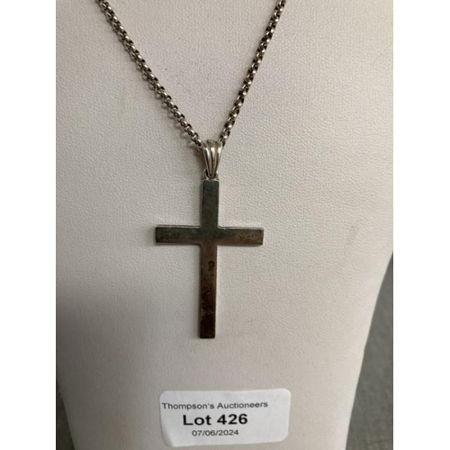 426 - Silver tone cross pendant on silver chain, 46cm long