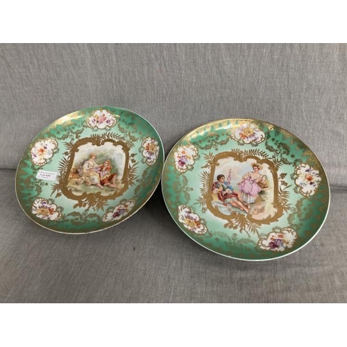 428 - Two Victoria Carlsbad Austria hand painted porcelain plates signed Boucher, 29.5cm diameter