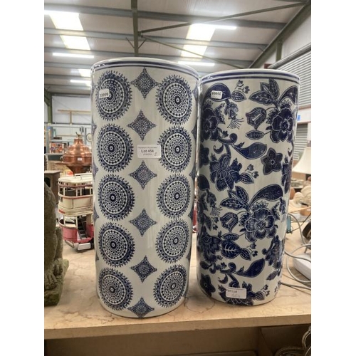 454 - 2 blue & white ceramic stick/ umbrella stands