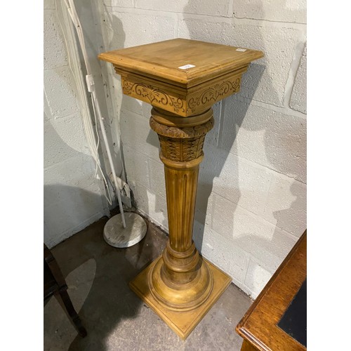 34 - Carved wooden plinth 115H 33W 33D with a resin urn 56H