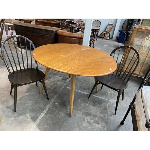 109 - Ercol elm drop leaf table 72H 125W 113D (top as found) and 2 hoop back Ercol chairs