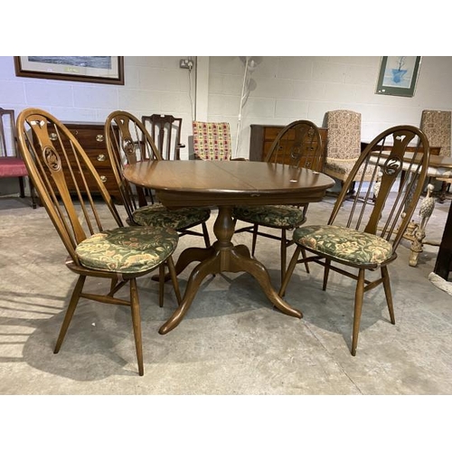 111 - Ercol ‘Chester’ elm dining table 73H 149W 90D and 4 ‘Swan’ back dining chairs