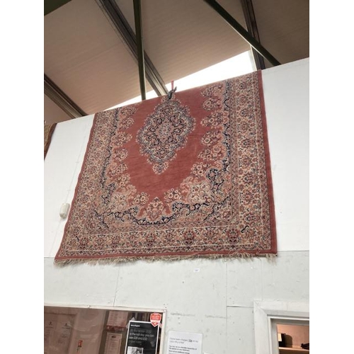 482 - Terracotta ground Persian style rug 224 x 170cm