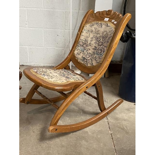 60 - Carved fruitwood folding rocking chair 44W