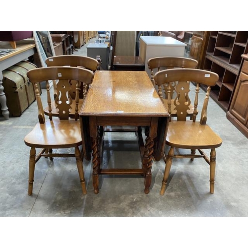 117 - Oak barley twist drop leaf table 74H 148W 105D and 4 chairs