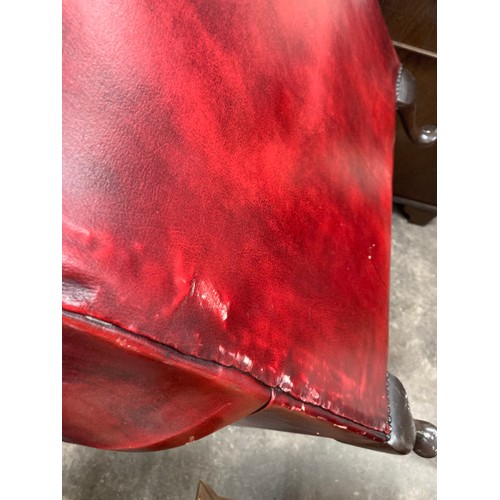 161 - Ox blood leather Chesterfield wing armchair 84W (damage to leather, sold as seen)