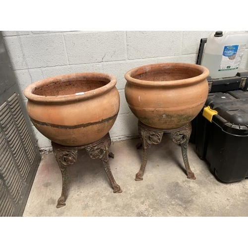 1 - Pair of terracotta planters on cast metal bases 73H 53cm diameter