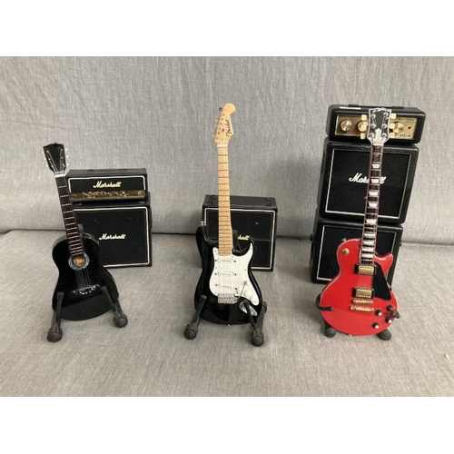 469 - 3 miniature guitars including personal mini amp