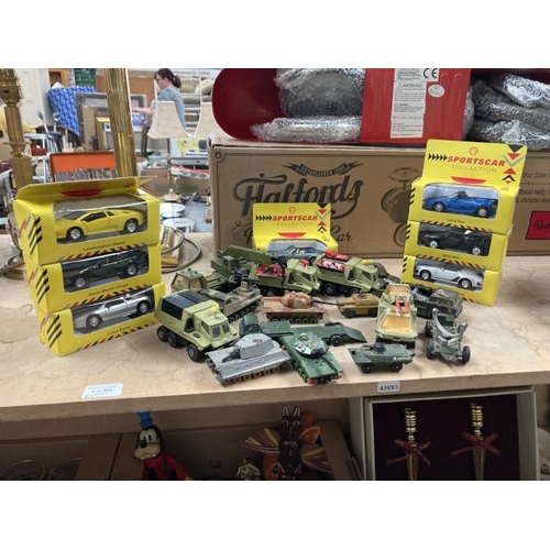 490 - 7 boxed Sportscar collection model cars & a collection of play worn tanks & trucks inc. Matchbox, Co... 