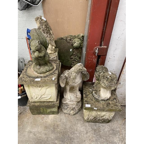 131 - Assorted stone effect garden statues and plinths