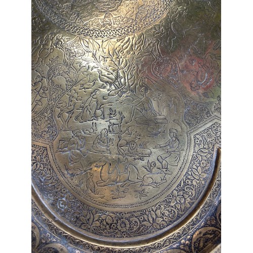 278 - 19th century Persian Qajar brass tray with fine detailing of horseman, hunters etc., 65cm diameter