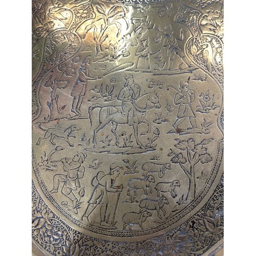 278 - 19th century Persian Qajar brass tray with fine detailing of horseman, hunters etc., 65cm diameter