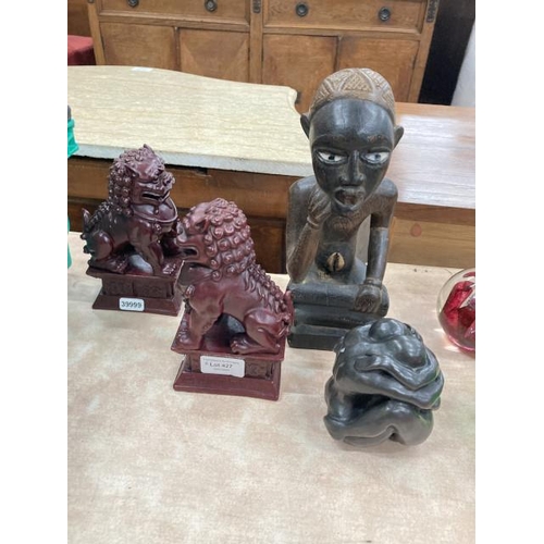 427 - Resin lovers figurine, treen tribal carved figurine and a pair of oriental style bookends