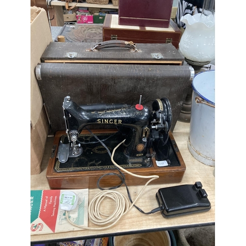 436 - Electric cased Singer sewing machine EJ774700  with foot pedal and manual