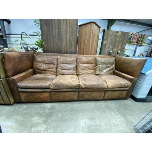 109 - Maison Jansen ‘Knole’ tan leather settee 244W with brass studs (please note wear and fading to the l... 