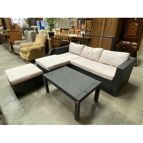 130 - Black rattan garden corner settee 62H 203W 144D, footstool 29H 60W 60D & occasional table 42H 92W 58... 