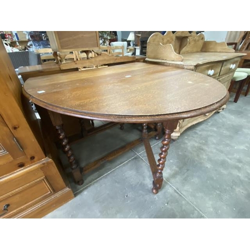 198 - Oak barley twist drop leaf table 73H 54W 50-145D