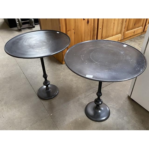 232 - 2 black metal pedestal occasional tables 62H 57cm diameter