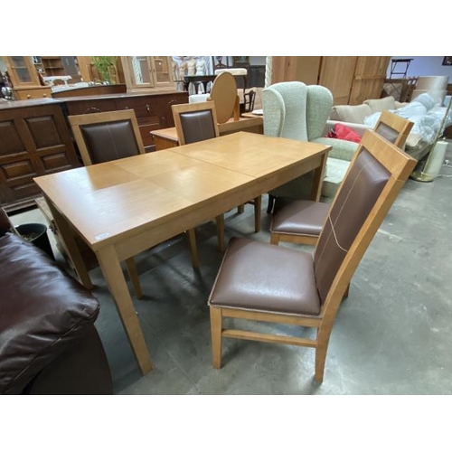 33 - Oak extending dining table 74H 150-180W 80D and 4 chairs