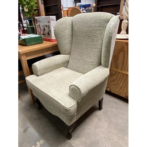 35 - Pale green chenille wing back armchair 78W