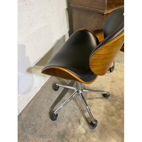 140 - Eames style walnut framed swivel office chair 53W