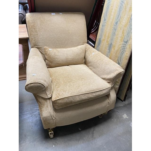 36 - Multiyork gold chenille armchair with arm covers and a bolster cushion 86W